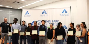 Youth receives their scholarships at special celebration